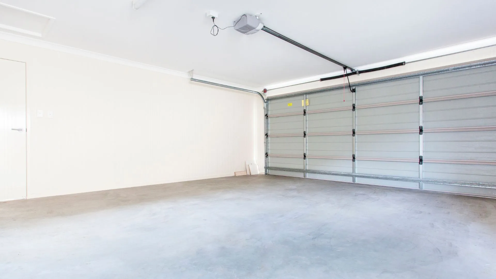 Garage door opener motor and rail